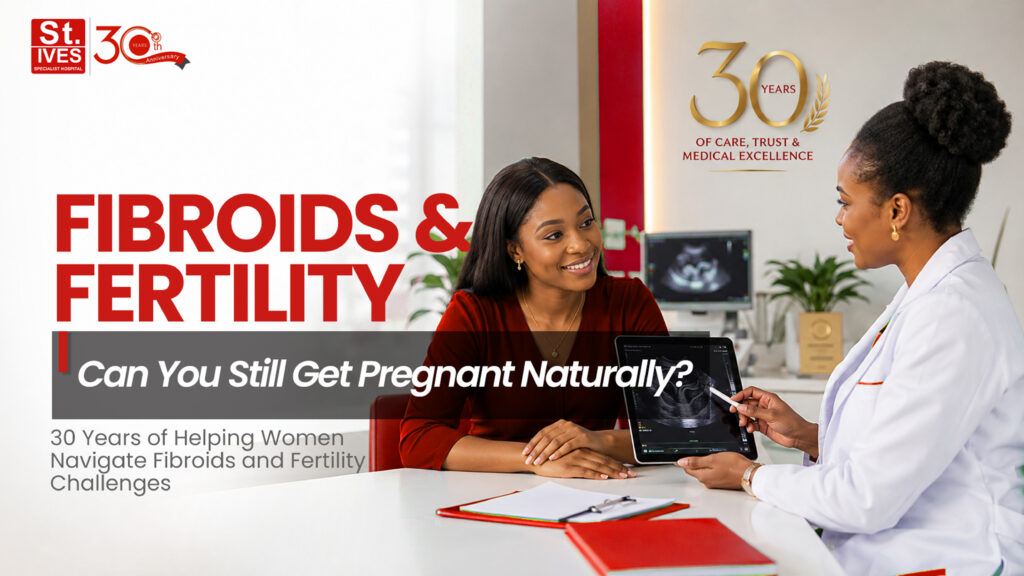 Nigerian fertility specialist discussing fibroid diagnosis and fertility options with a female patient during a consultation at St. Ives Specialist Hospital.