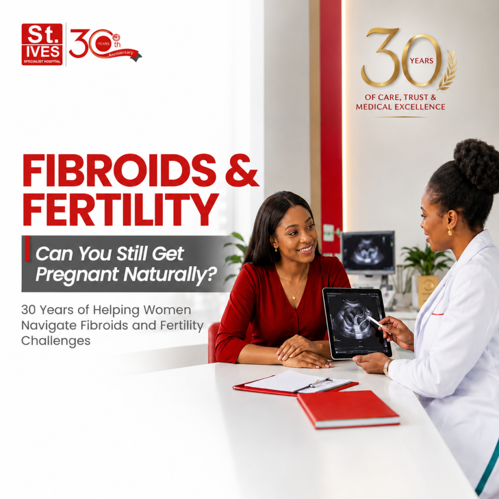 Nigerian fertility specialist discussing fibroid diagnosis and fertility options with a female patient during a consultation at St. Ives Specialist Hospital.